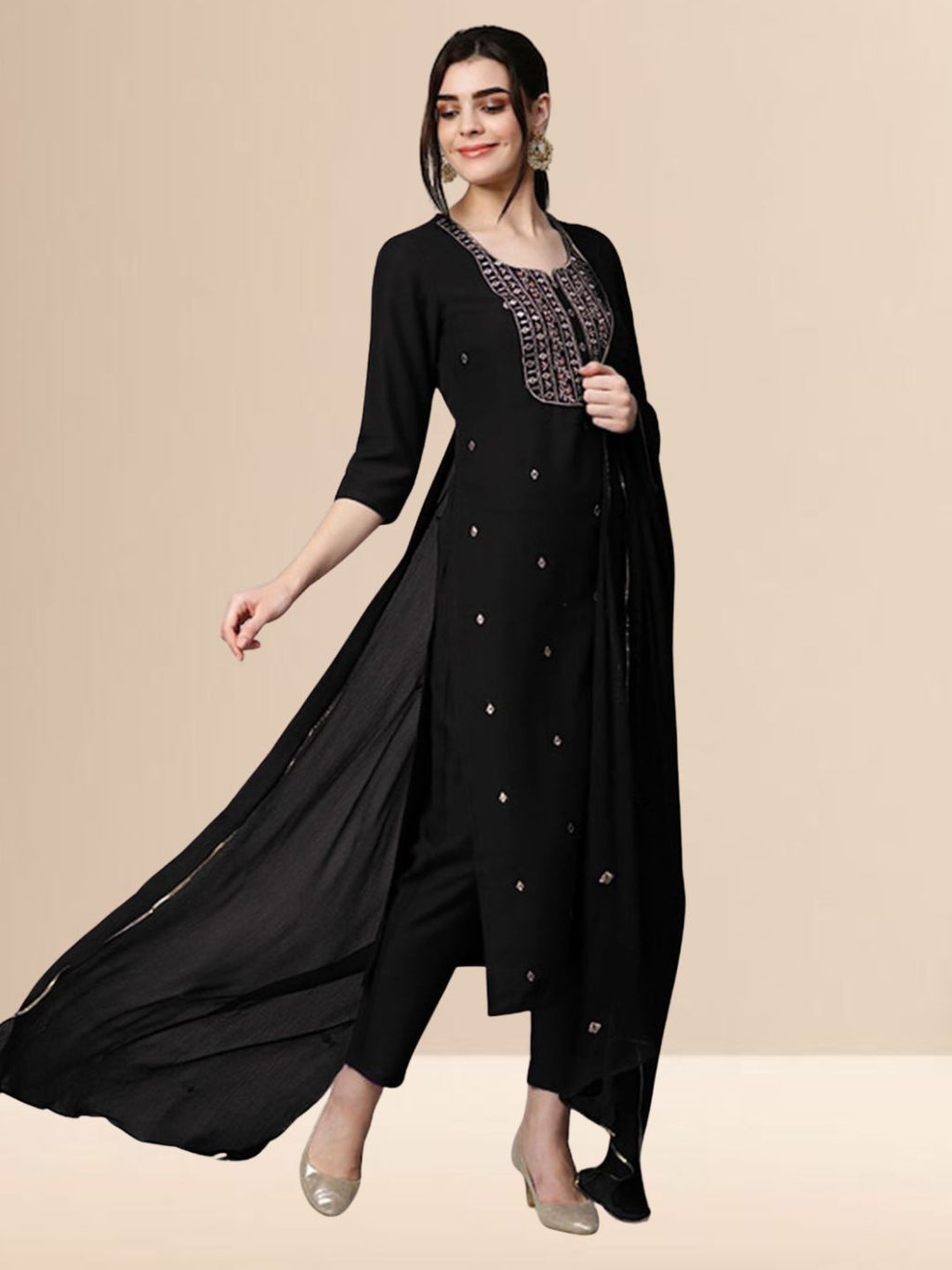 Woman wearing a black embroidered georgette kurta set with trousers and a dupatta, suitable for festive and daily wear.