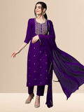 Woman wearing a royal purple embroidered rayon kurta set with trousers and a dupatta, ideal for festive and daily wear.