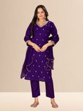Woman wearing a royal purple kurta set with gold embroidery on the neck and sleeves, paired with trousers and a dupatta.