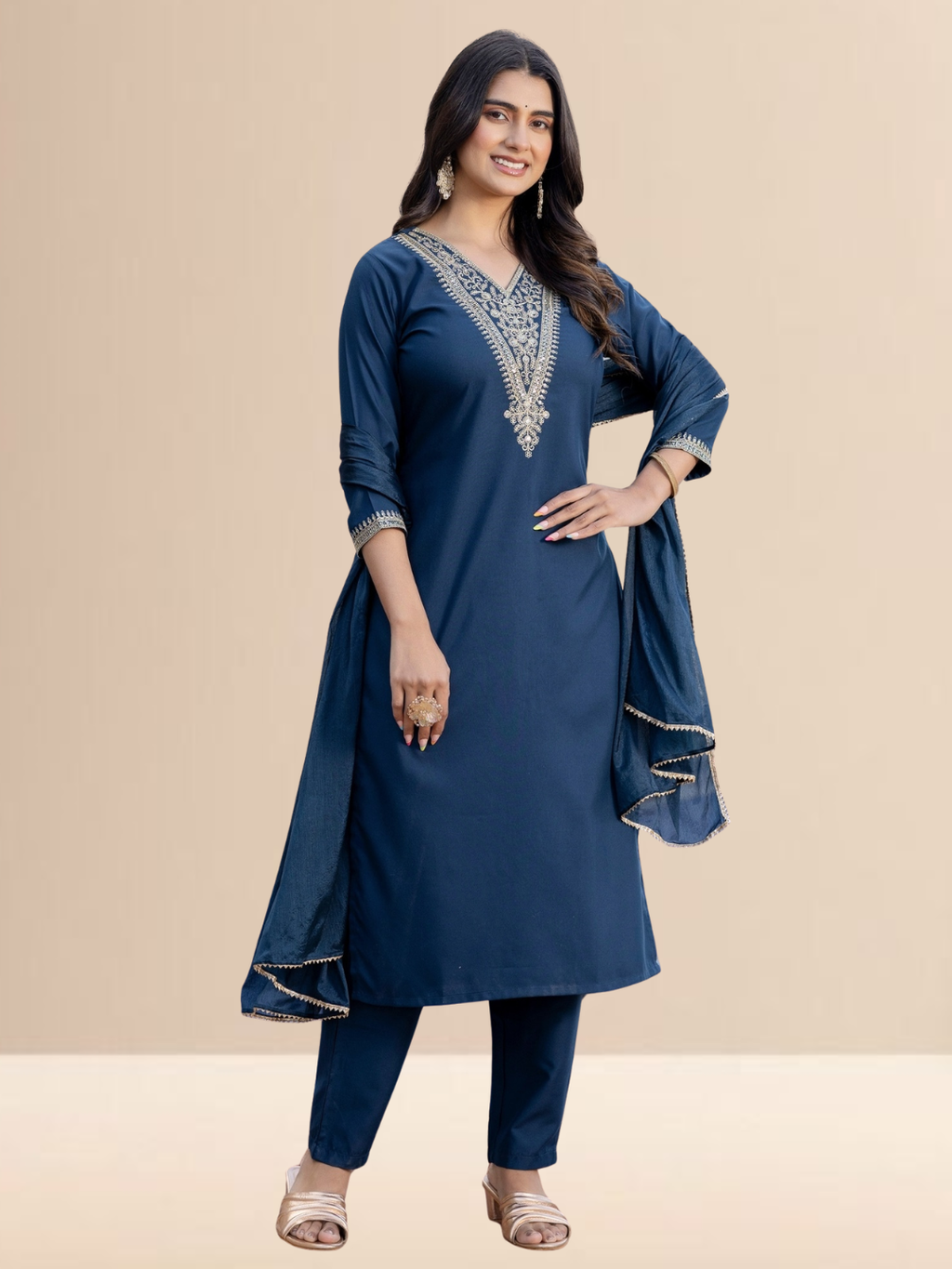 Woman wearing a teal blue cotton blend kurta set with intricate golden V-neck embroidery, matching pants, and a dupatta with gold lace borders.