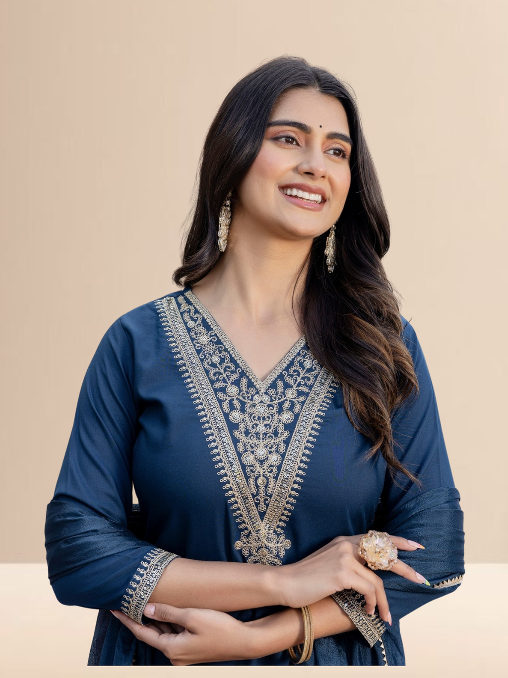 Woman wearing a teal blue cotton blend kurta set with intricate golden V-neck embroidery, matching pants, and a dupatta with gold lace borders.
