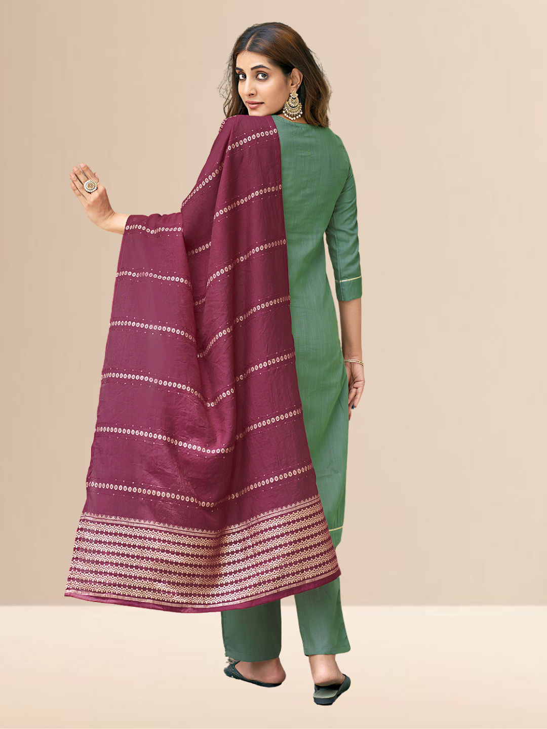Woman wearing a sea green cotton blend kurta with an embroidered V-neck and a wine-colored striped dupatta.