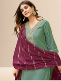 Woman wearing a sea green cotton blend kurta with an embroidered V-neck and a wine-colored striped dupatta.