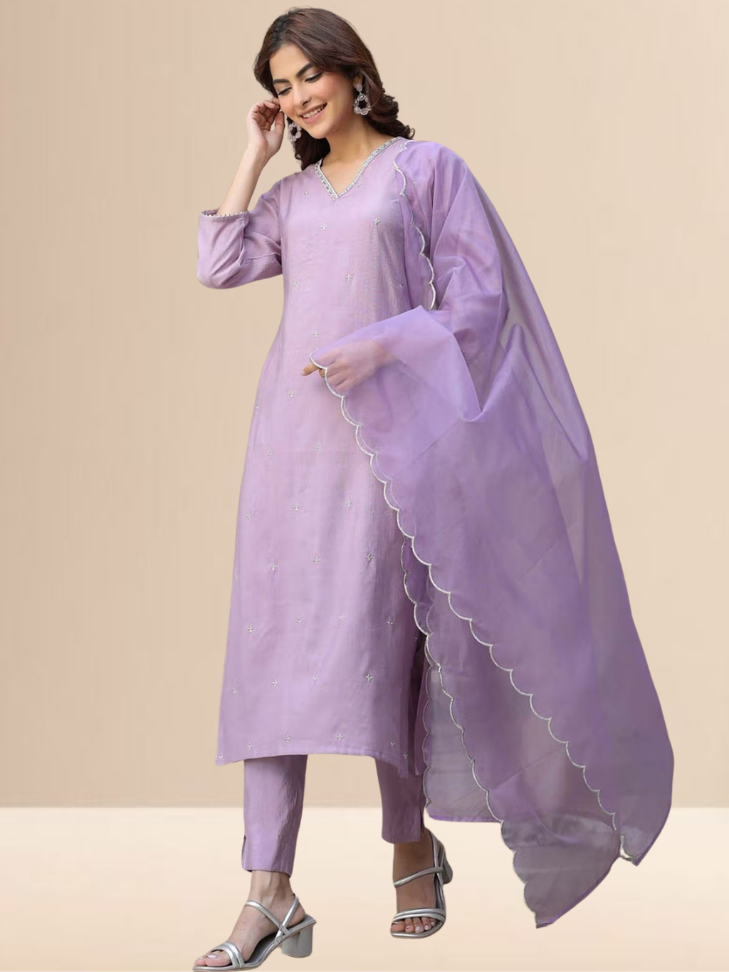 Woman wearing a lavender cotton blend kurta set with V-neck embroidery and a sheer scalloped edge dupatta.