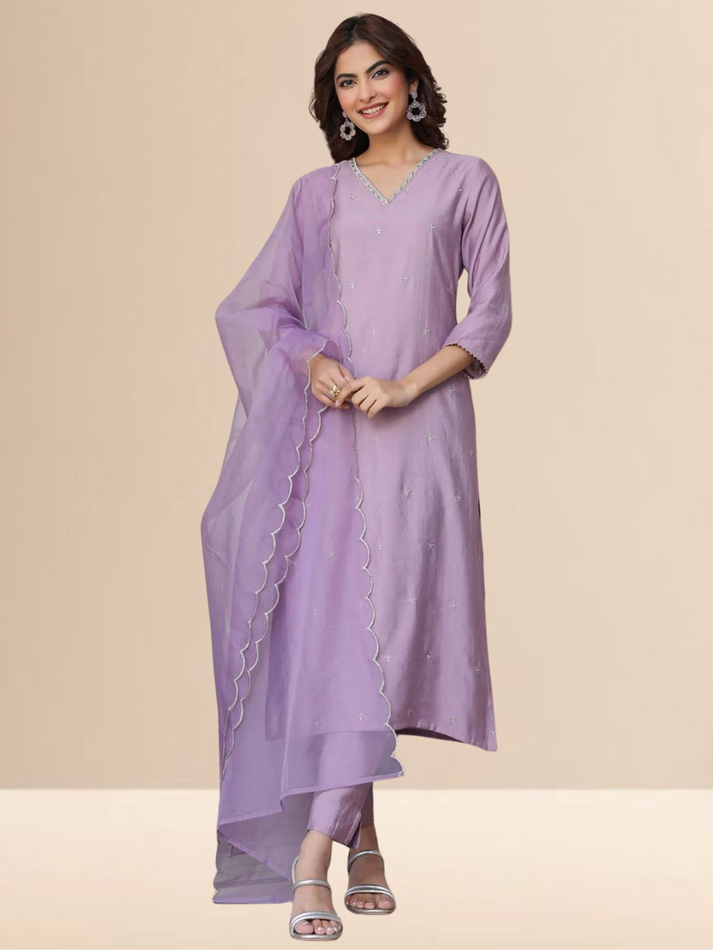 Woman wearing a lavender cotton blend kurta set with V-neck embroidery and a sheer scalloped edge dupatta.