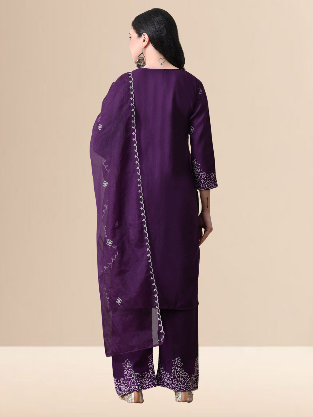 Woman wearing a deep purple cotton blend kurta set with white V-neck embroidery and a sheer scalloped dupatta.