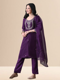 Woman wearing a royal grape purple blend kurta with silver yoke embroidery, matching straight pants, and a purple organza dupatta.