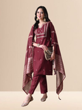 Woman wearing a maroon cotton blend kurta set with intricate silver embroidery on the yoke and a matching striped -style dupatta.